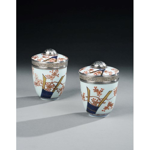 A pair of Japanese silver mounted imari porcelain pots and covers